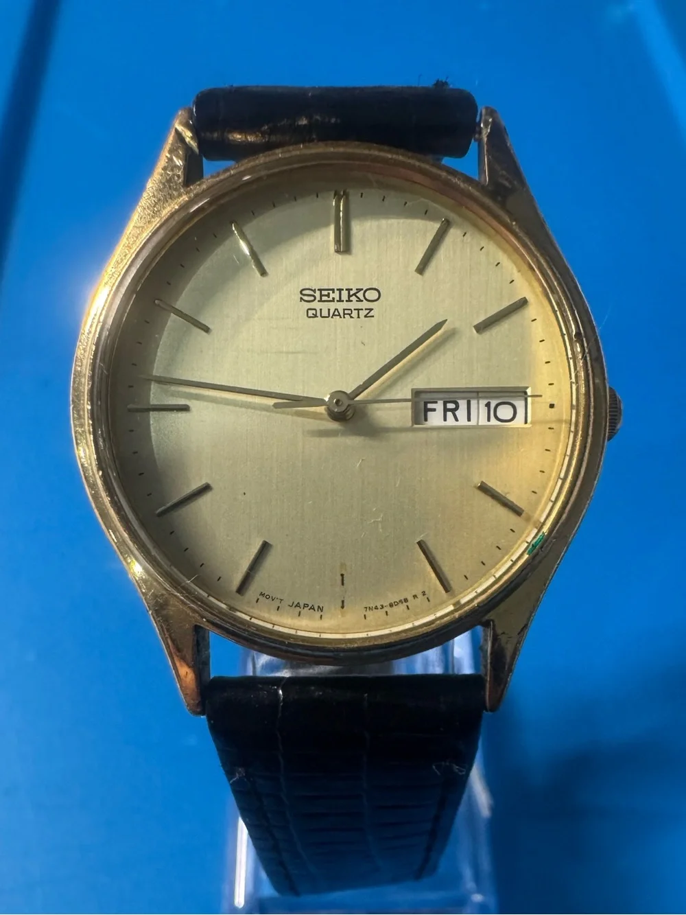 Seiko Gold Dial Watch with Black Strap